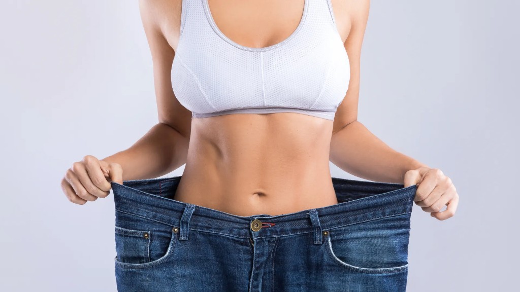 A woman wearing loose jeans, reflecting gradual changes to her routine